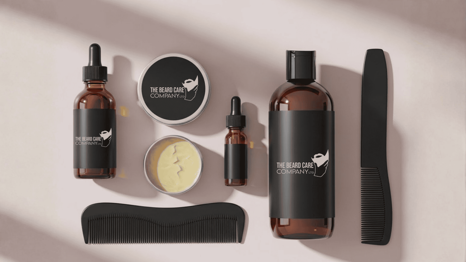 Collection of The Beard Care Company products including beard oils, a beard balm, and combs on a light background